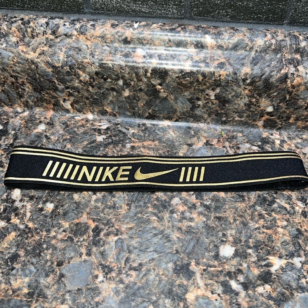 Nike headband black and gold . Never worn